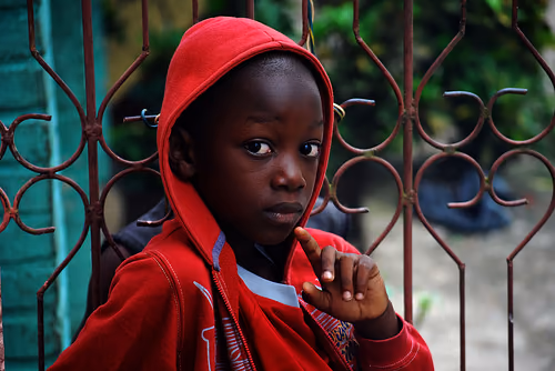 Haitian boy in red hoodie